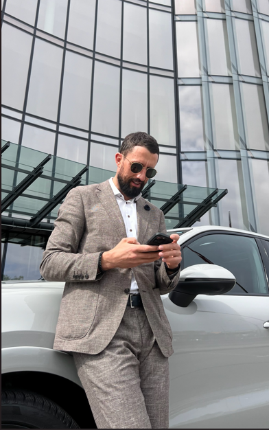 Edgars Kozaks writing at his desk